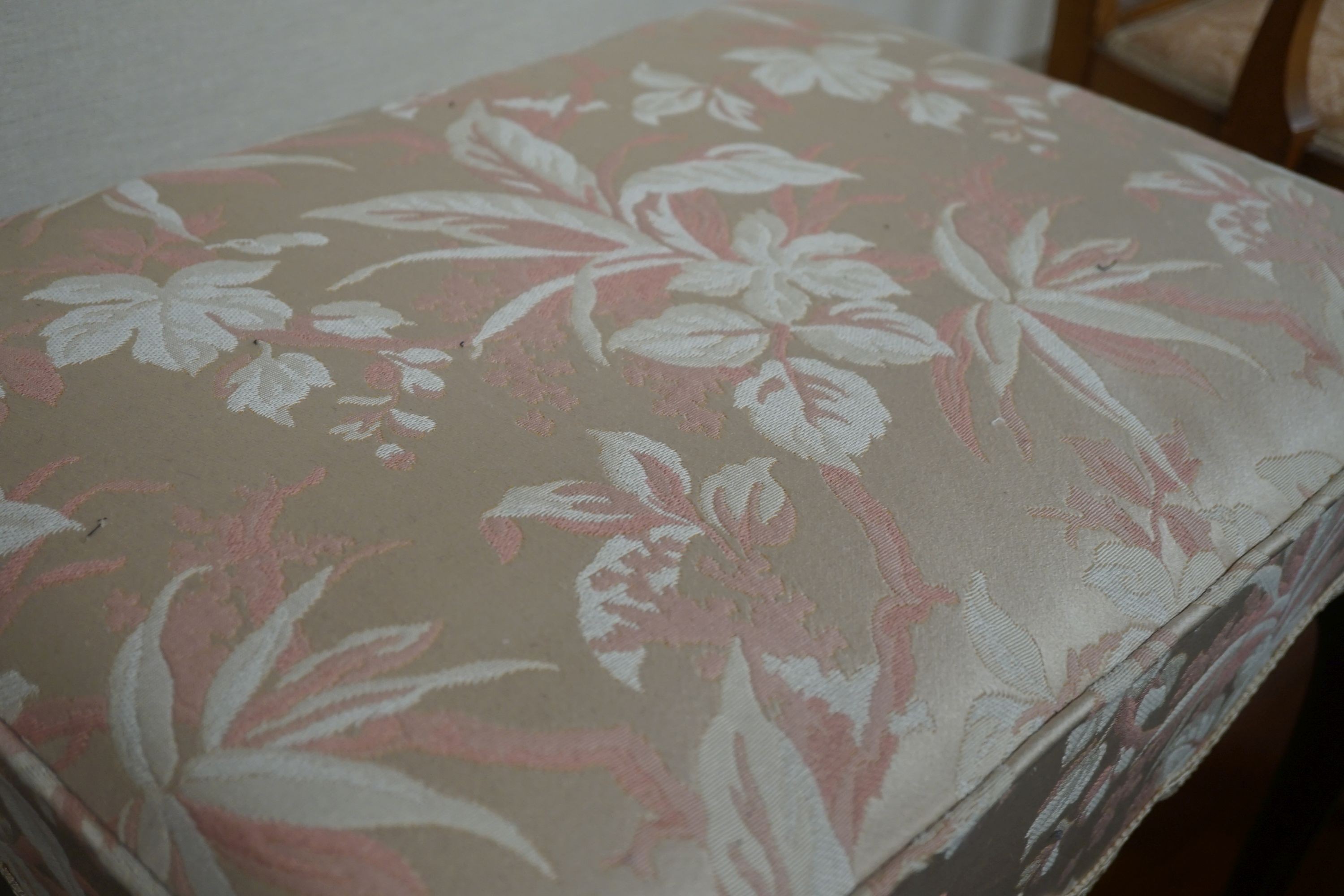 An upholstered footstool, width 60cm, depth 44cm, height 53cm